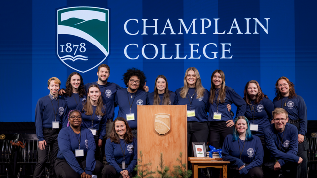 The Champlain College Student Ambassadors team joins together onstage.